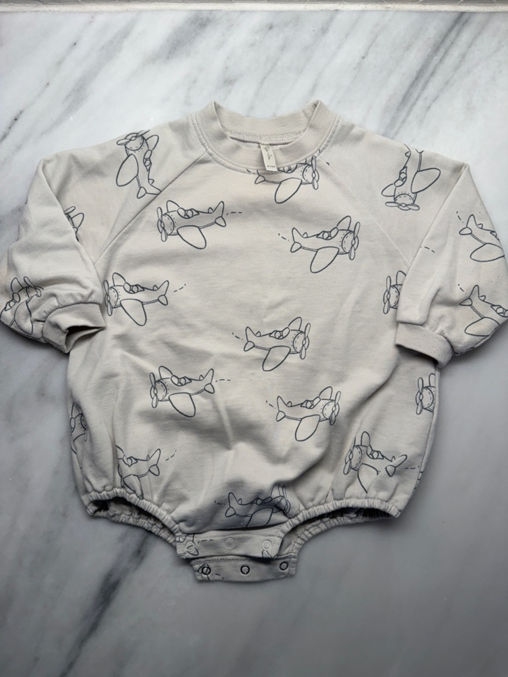 Rylee + Cru Cream Baby One-Piece with Navy Airplane Print